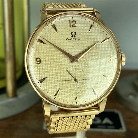 vintage omega solid gold watch